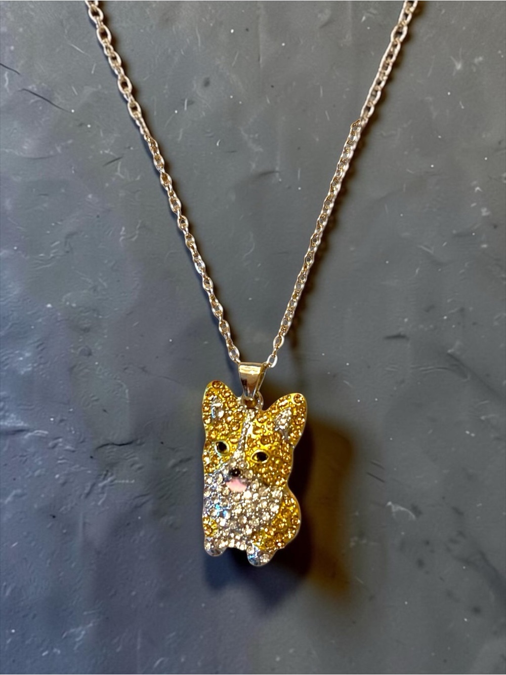 Corgi pendant necklace featuring a "pave" style design
